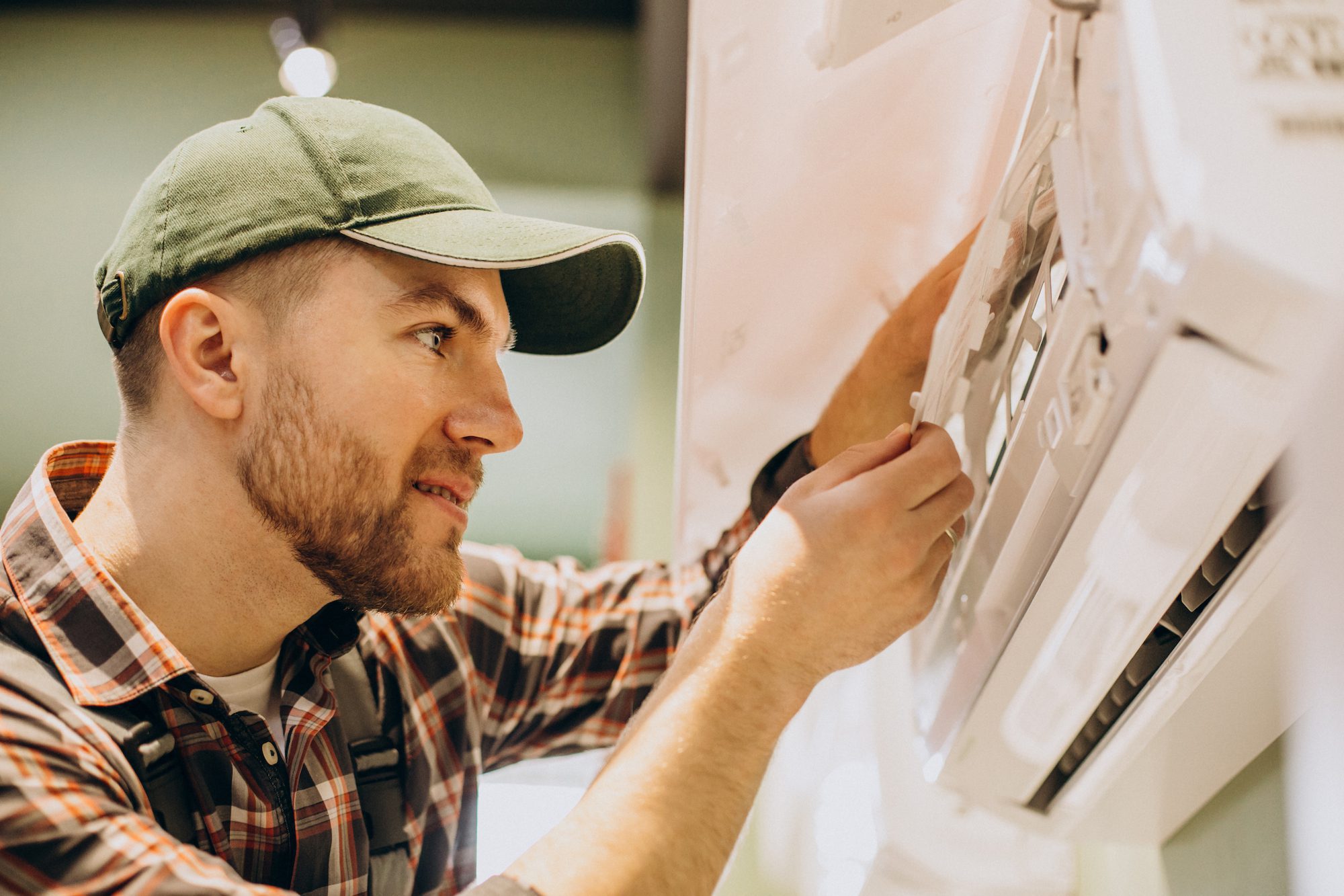 Repairman doing air conditioner servise optimize your air conditioner